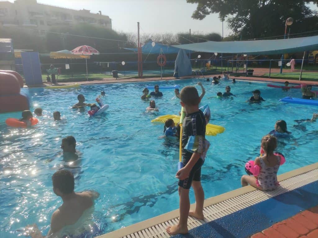 children play in the pool at a CoreTigo company event